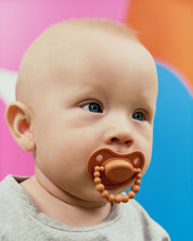 Smoczek pozycjonujący LUU Kids Pumpkin Spice gumka pomarańczowy